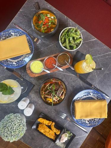 a table with plates of food on a table at Yak & Yeti in Shrewsbury