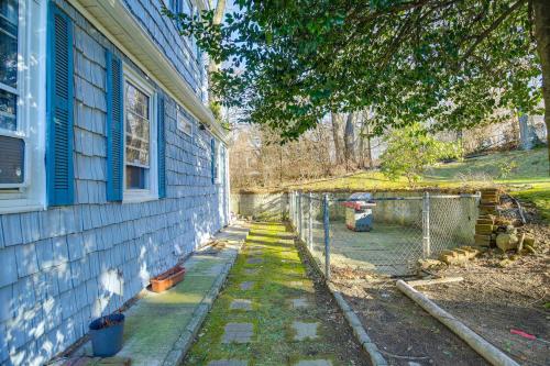 a side of a house with a tree and a fence at 3 Mi to Downtown Spacious White Plains Home in White Plains