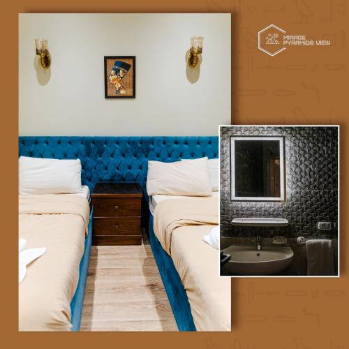 a hotel room with two beds and a television at Mirage pyramids view hotel in Cairo