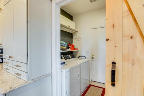 a kitchen with a white cabinet and a counter at Mtn-View Escape with Hot Tub in Sparks! in Sparks