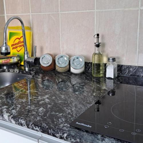 a kitchen counter top with a sink and a counter top at Monoambiente Neli in Villa Pehuenia