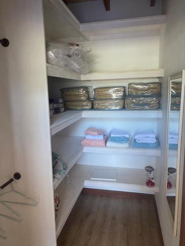 a walk in closet with some towels in it at Mateo&Colo in Panguipulli