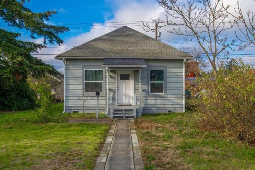 a small white house with a pathway leading to it at Steampunk Haven in the Heart of Tacoma! in Tacoma