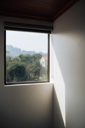 a window in a room with a view at TamCoc Peaceful Homestay in Vũ Lâm