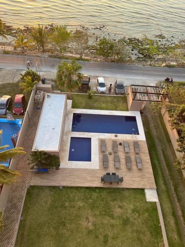 an aerial view of a house with a swimming pool at Apartment with sea view in Cozumel
