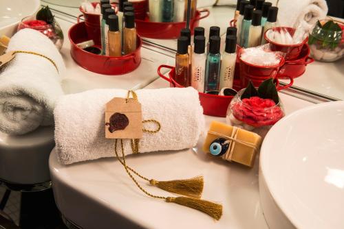 a bathroom counter with a towel and a sink at Sura Hagia Sophia Hotel in Istanbul