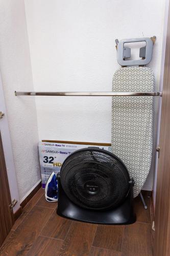 a large black mat sitting on the floor next to a refrigerator at Departamento cerca de Zoológico y Estadio Jalisco in Guadalajara