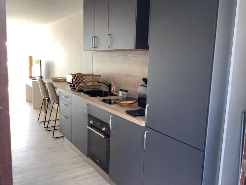 Η κουζίνα ή μικρή κουζίνα στο Studio 16 Vue mer Orient Beach