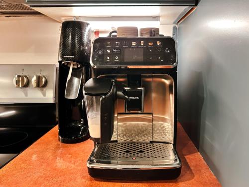 a coffee maker sitting on a counter in a kitchen at Peaceful Golf Spa in Collingwood