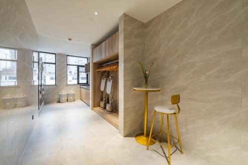 a hallway with a bar and stools in a house at Meilun Hotel Shanghai International Tourist Resort in Shanghai