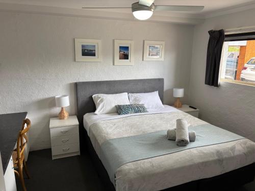 Ένα ή περισσότερα κρεβάτια σε δωμάτιο στο Merimbula Lake Apartments