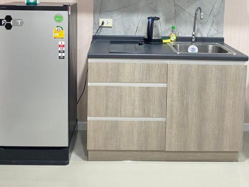 Kuchyň nebo kuchyňský kout v ubytování The city hatyai condo B410
