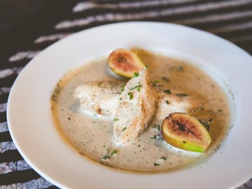 a white bowl of soup with fish and peaches at LA TERRA NAGANOーVacation STAY 80689v in Shiojiri
