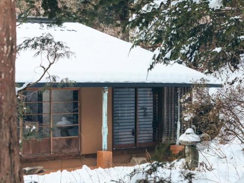 a house with a window in the snow at LATERAL - Vacation STAY 36594v in Shiojiri