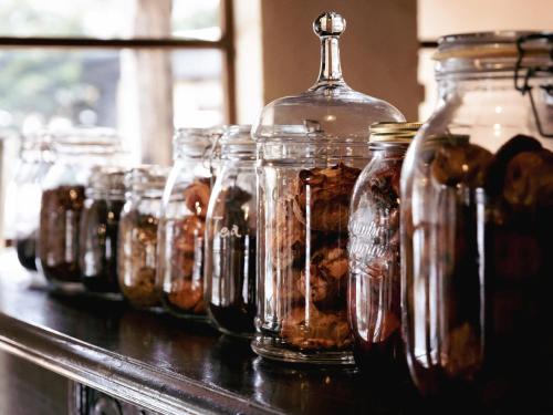 a row of jars filled with nuts on a table at LATERAL - Vacation STAY 36594v in Shiojiri