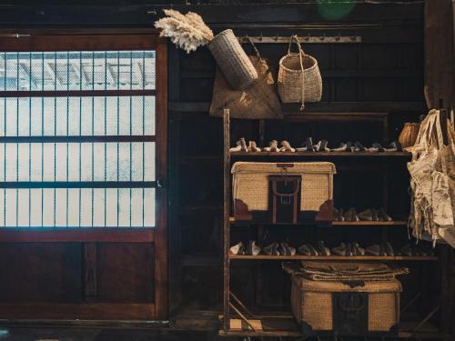 a shelf of shoes in a room with a window at LATERAL - Vacation STAY 36594v in Shiojiri