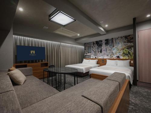 Ένα ή περισσότερα κρεβάτια σε δωμάτιο στο MONday Apart Premium OSAKA NAMBA WEST