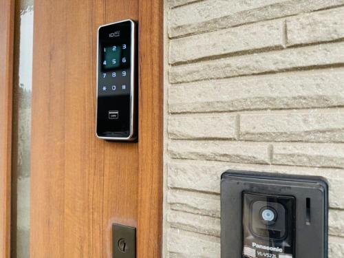 a remote control attached to a house with a mailbox at Nest Kisarazu in Kisarazu