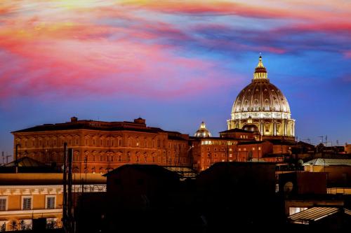 a building with a dome on top of it at Ottaviano Guest House in Rome