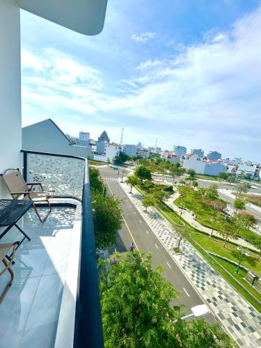 a balcony with a view of a city street at Sand Sea Hotel in Phan Thiet