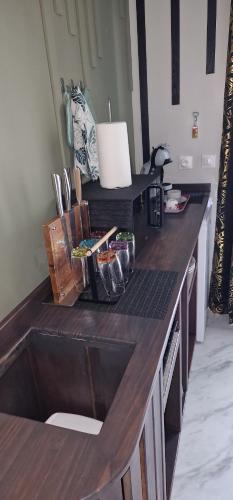 a kitchen with a wooden counter top with a counter sidx sidx sidx at Bungalow et Spa tiKub Malow in Saint-Pierre