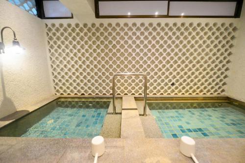 Ванная комната в Balcony Courtyard Sriracha Hotel & Serviced Apartments
