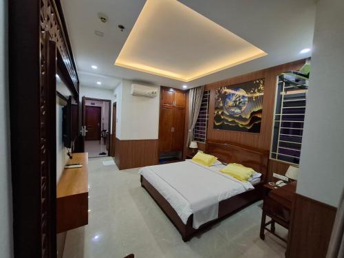 Ένα ή περισσότερα κρεβάτια σε δωμάτιο στο Hotel Phú Sĩ
