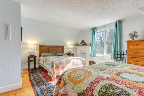 a bedroom with two beds and a window at Lakefront Family Home with Dock in Newport! in Newport
