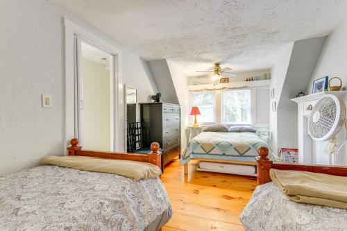a bedroom with two beds and a dresser at Lakefront Family Home with Dock in Newport! in Newport