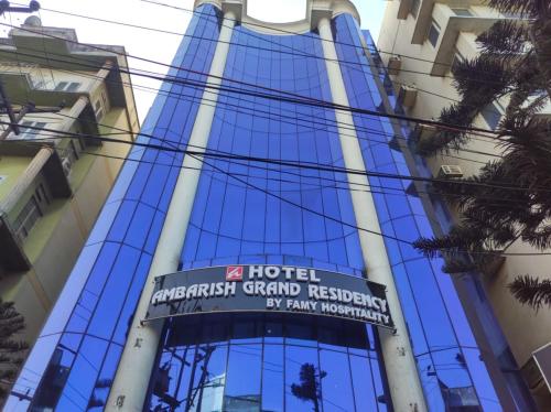 a hotel sign in front of a building at Hotel Ambarish Grand Residency in Guwahati