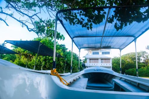 a boat ride down a ramp in a park at Mirissa Turtle Point Guest in Mirissa