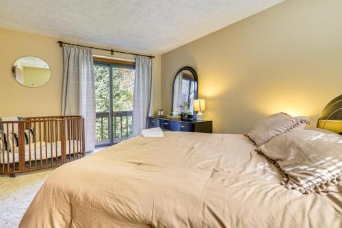 a bedroom with a large bed and a window at Walk to Beach Arrowhead Lake Home in Pocono Lake