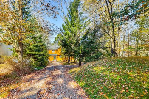 a road leading to a house in the woods at Walk to Beach Arrowhead Lake Home in Pocono Lake