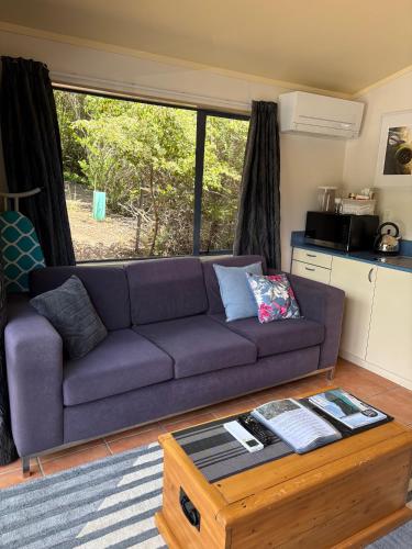 a living room with a couch and a coffee table at Dawson Downs in Upper Moutere
