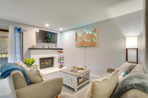 a living room with a couch and a fireplace at 3 Mi to Ski Slopes - Vermont Mountain Escape! in Mendon