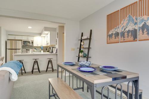a living room with a table and a kitchen at 3 Mi to Ski Slopes - Vermont Mountain Escape! in Mendon