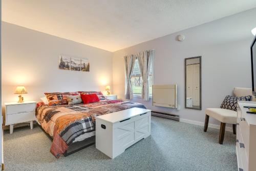 a bedroom with a bed and a chair and a window at 3 Mi to Ski Slopes - Vermont Mountain Escape! in Mendon