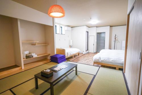 Ένα ή περισσότερα κρεβάτια σε δωμάτιο στο GOOD OLD HOTEL hirosaki