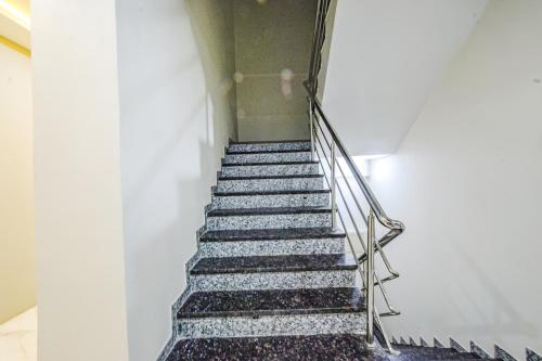 a flight of stairs in a building at FabHotel SSR Ikon Suites - Nr Hyderabad Central University, Kondapur in Hyderabad