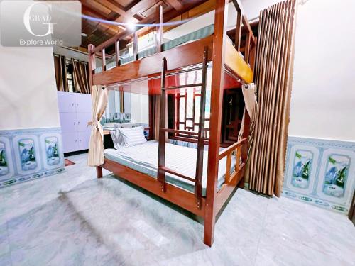 a bedroom with a bunk bed in a room at The Ridge Haven in Phong Nha
