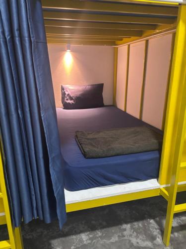 Postel nebo postele na pokoji v ubytování Scuba Square Hostel