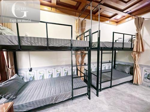 a bunk bed room with two bunk beds at The Hill Villas in Phong Nha