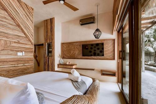 Katil atau katil-katil dalam bilik di CervecerIa Tulum Boutique Hotel & Beer Spa