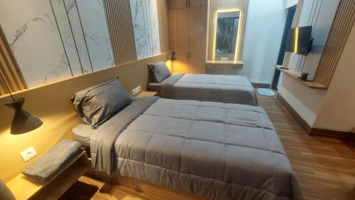 Postel nebo postele na pokoji v ubytování Mantra House