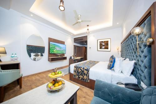 a hotel room with a bed and a couch at Solar Residency, Srinagar in Srinagar