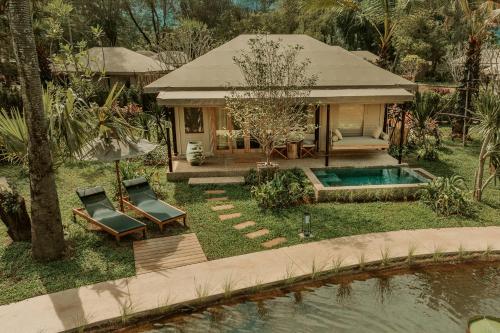 an aerial view of a house with a swimming pool at Twinpalms Tented Camp Phuket in Bang Tao Beach