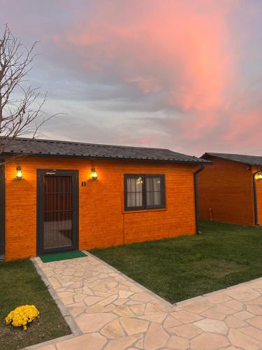 a home with an orange brick house with a patio at Some Hotel Antakya in Hatay