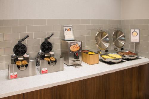 a buffet line with food on a counter at Fairfield Inn & Suites by Marriott Dayton in Dayton