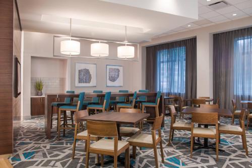 a conference room with tables and chairs and windows at Fairfield Inn & Suites by Marriott Dayton in Dayton