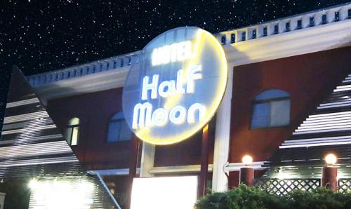 a hotel neon sign in front of a building at ハーフムーン富士宮 Adult only in Fujinomiya